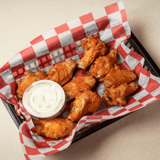 Wings on red checkered paper