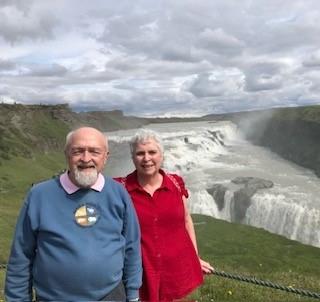 Nancy and Phil Kukura ’57 in front of waterfall