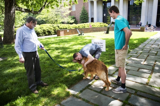 Rob Spach with dog at Chaplains' Cafe