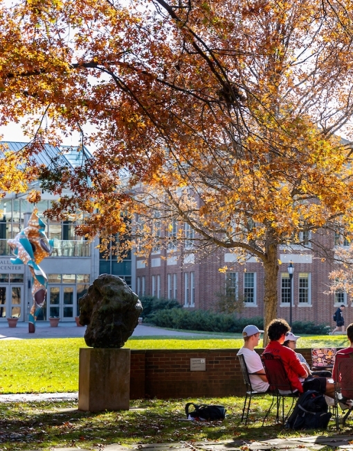 Outdoor Class with Fall Foliage in Background