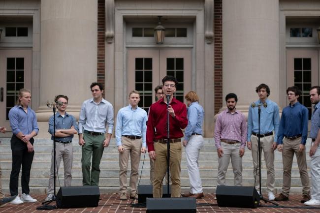 A group of young men singing a cappella