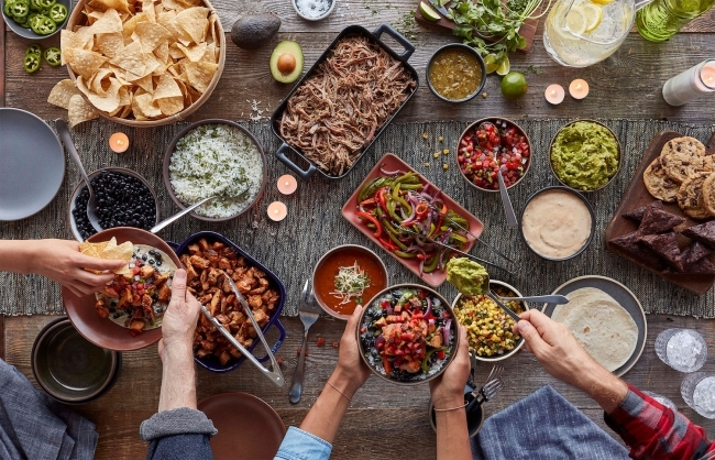 Qdoba catering with chips, salsa, and guac