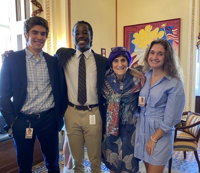 Nathanael Bagonza ’24 with three other people