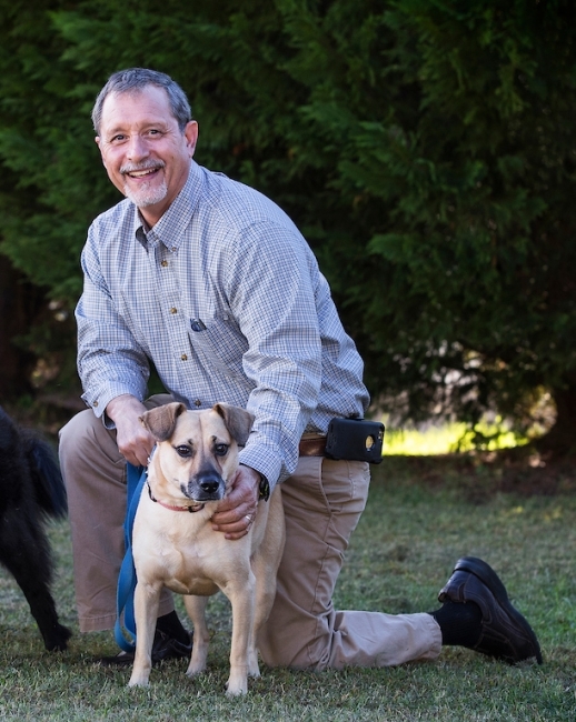 Julio Ramirez holding dog