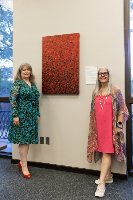 Sarah Guthrie and Eliz Kirkland with Library Artwork