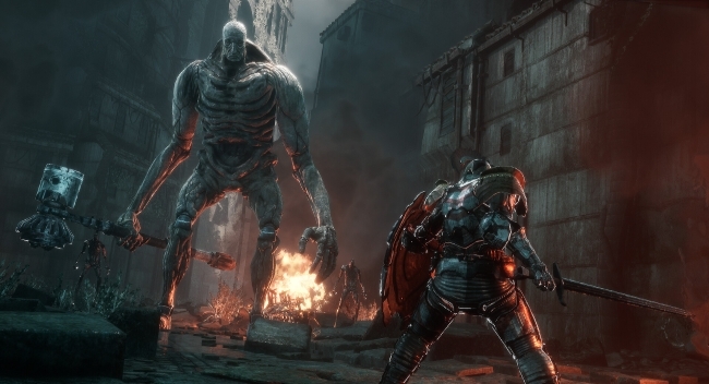 a scene from a video game where a figure in armor fights a monster