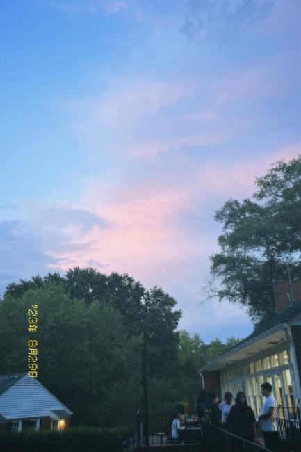 a pastel sky at dusk above a student life center