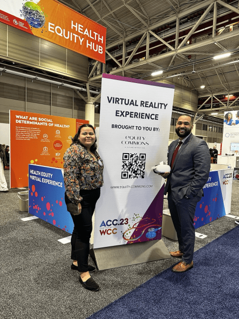 two young people stand together in front of a sign that reads "virtual reality experience"