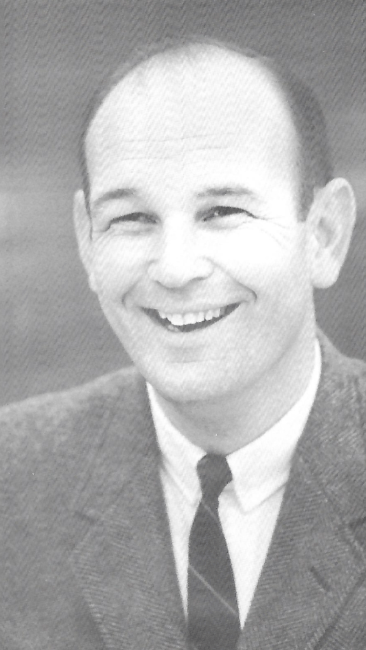 a young white man wearing a suit and tie