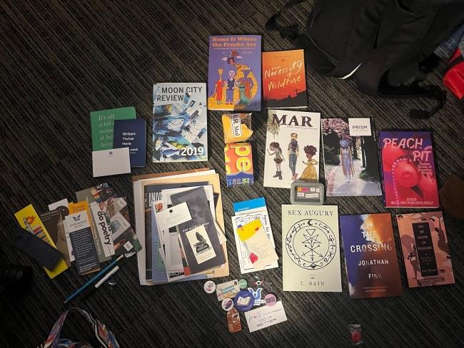 a collection of books on a black carpet