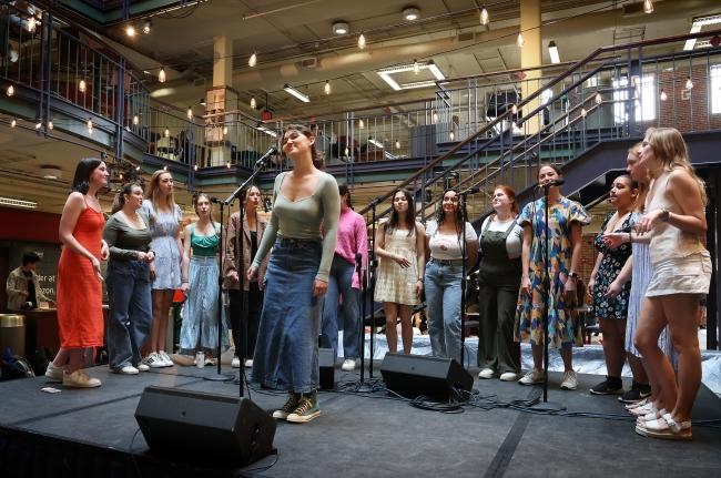 a group of young people singing 