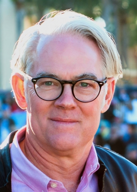 a middle aged white man wearing glasses