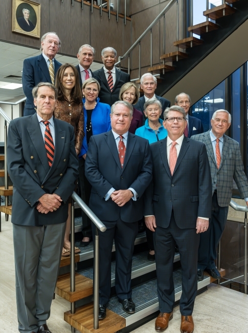 a group of people standing on a set of stairs