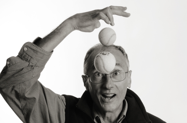 Bill Giduz juggling with tennis balls