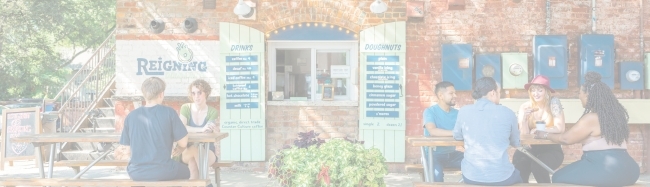 Reigning Doughnuts exterior with customers