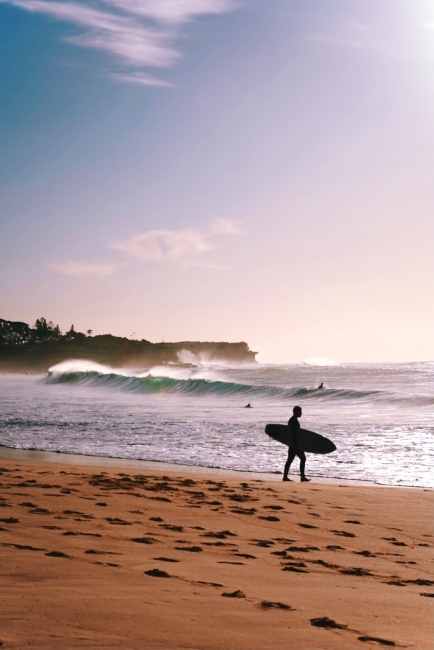 a surfer on a beach