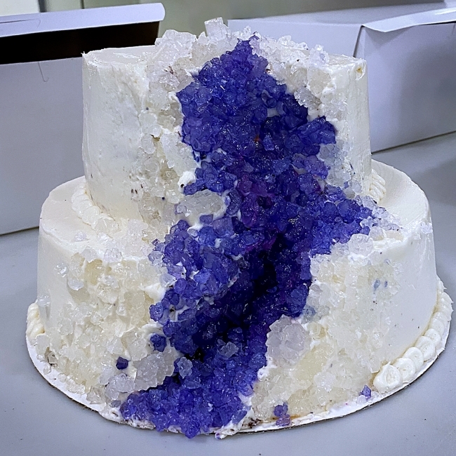 a cake decorated to look like a purple geode