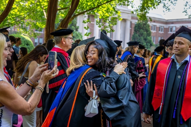 Commencement 2025 student and professor hugging