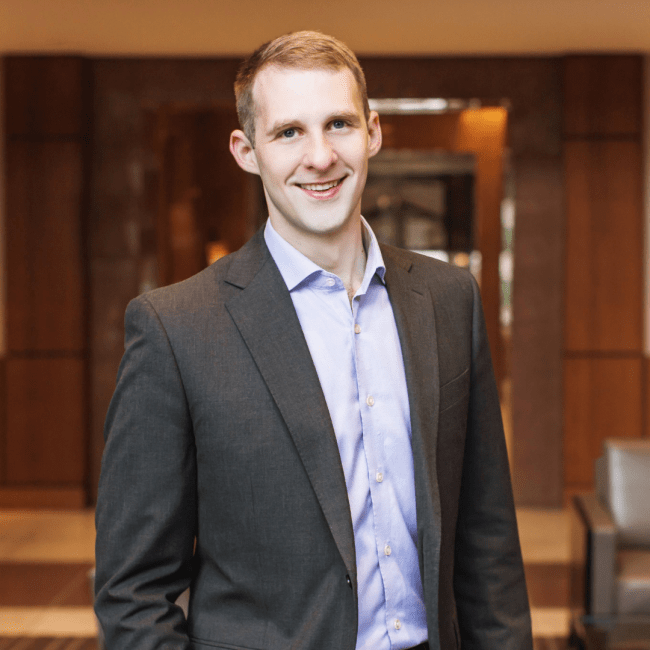 a young white man wearing a suit