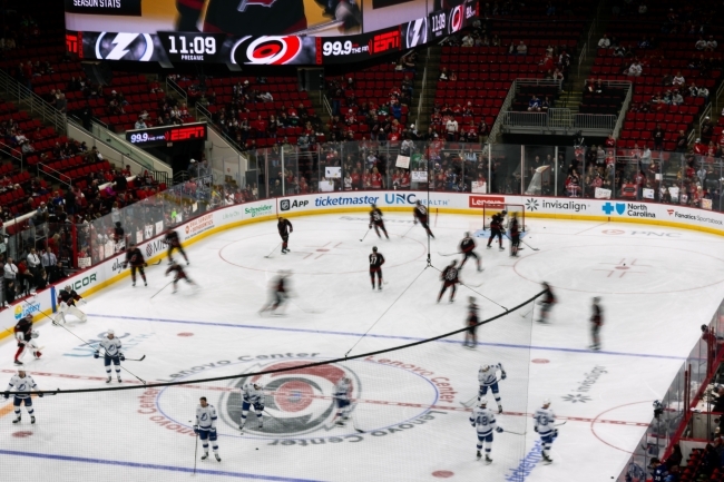 an aerial view of a hockey game on a rink