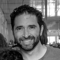 Black and white photo of a man with a beard