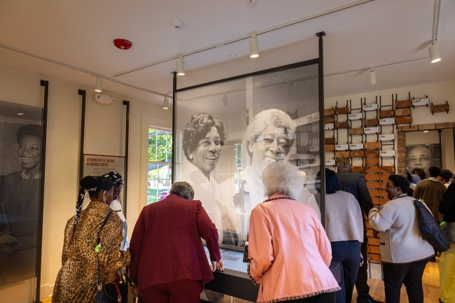Scene inside the Oak Row museum featuring artwork and archival photography