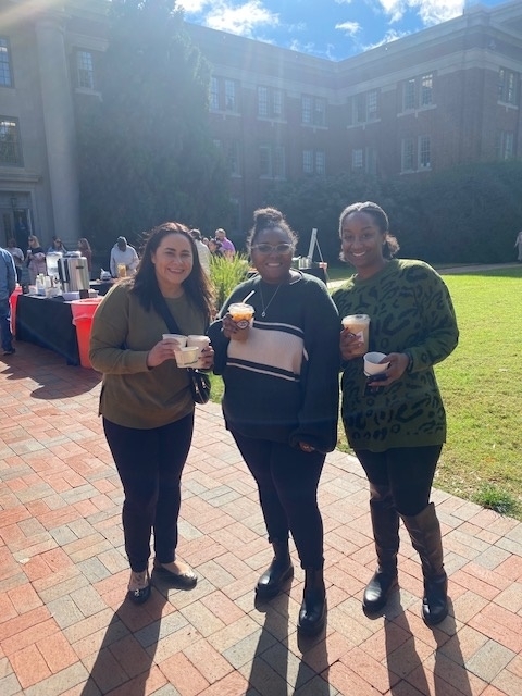 Employees drink coffee at staff council event