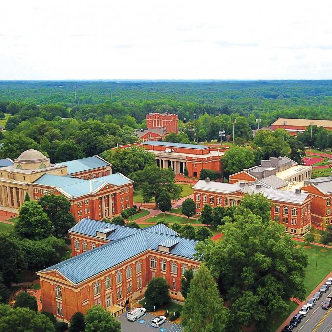 Aerial of Davidson College campus showing lots of campus buildings and trees