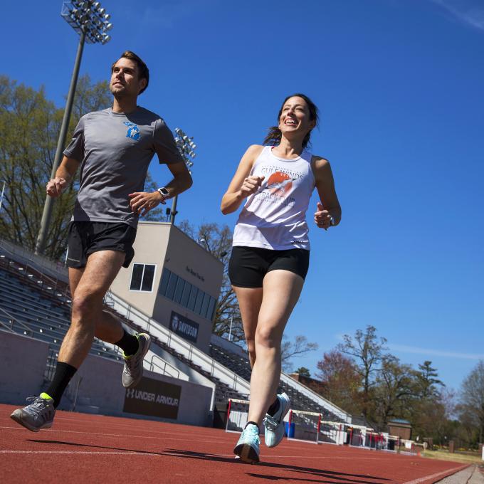 Two physics professors run on the track