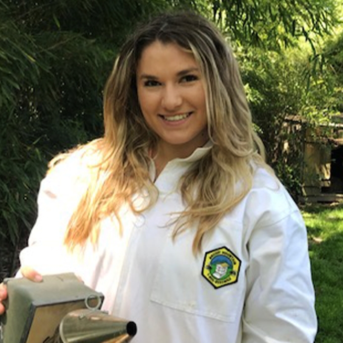Katie Soden '21 tending to her bees