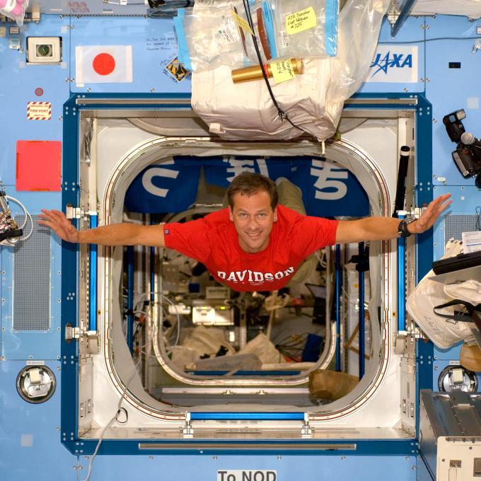 Tom Marshburn in spaceship with Davidson t-shirt on