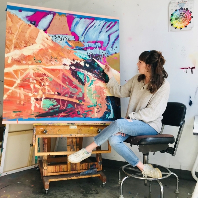 Adelle Patten with a painting
