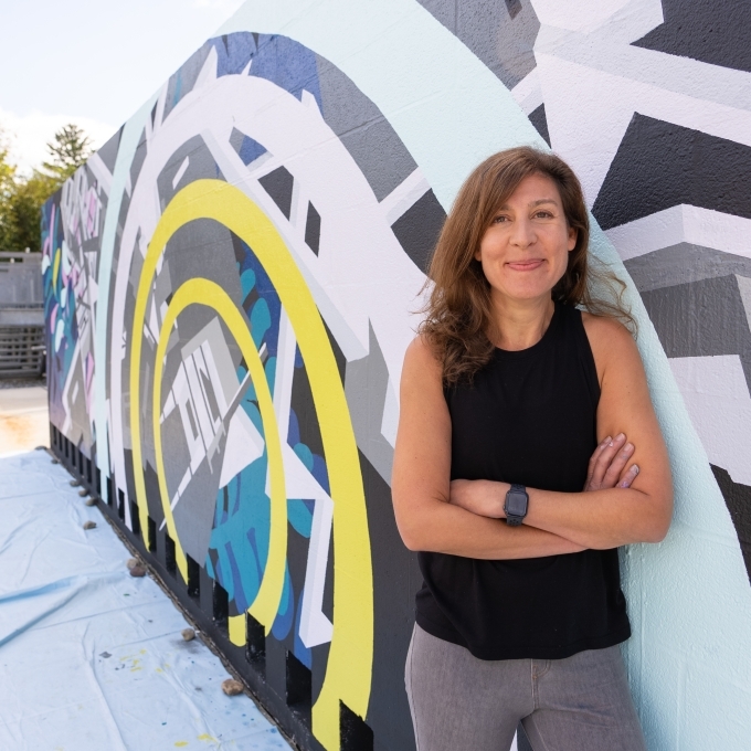 Davidson College Prof. Joelle Dietrick poses by mural project at Dickinson College