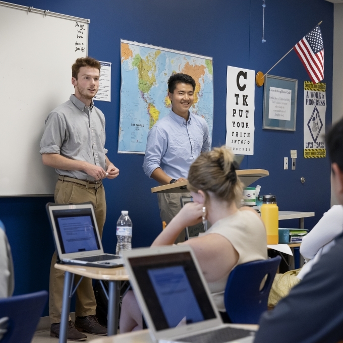 Students teach high school economics class