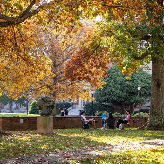 campus scene in front of colorful trees