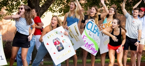 Students cheering at the cake race
