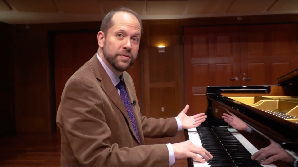 Neil Lerner playing music on the piano