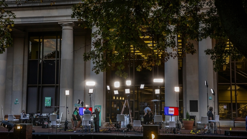 Library front with CNN monitors and recording crew and equipment
