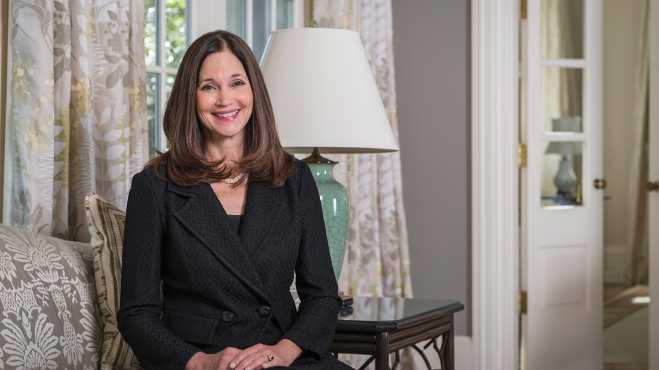 Carol Quillen sitting on a chair