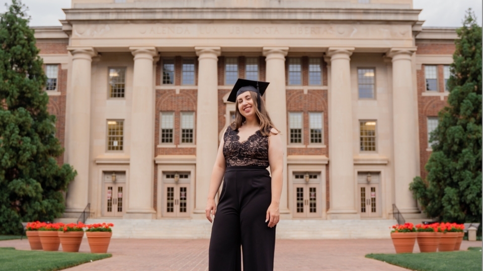 Chloe deBeus ’21 in front of Chambers Building