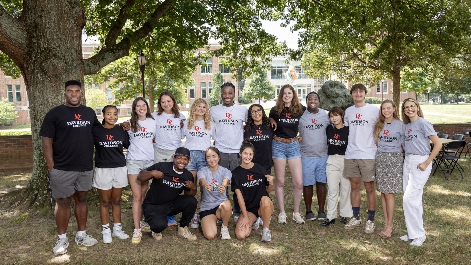 Students wearing tshirts with the new visual identity