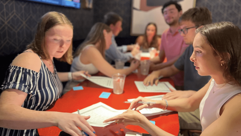 A group of students meeting around a table