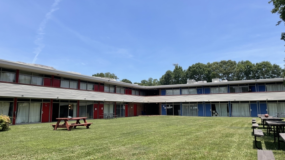 a large apartment complex with a courtyard in the center