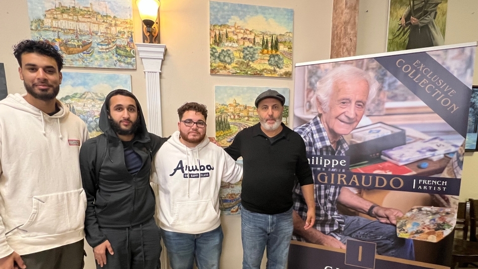 a group of students with an older artist standing together