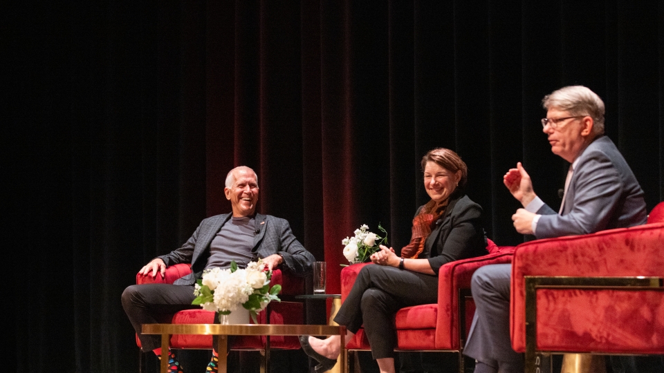 U.S. Senators Thom Tillis and Amy Klobuchar on stage with President Doug Hicks at Davidson College