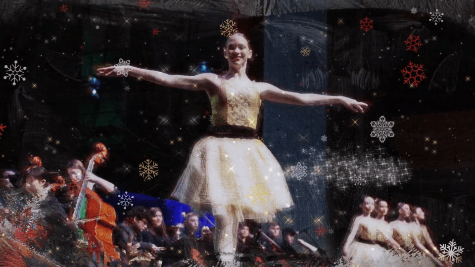 2026 Holiday Video Still Ballerina on stage with orchestra to the side