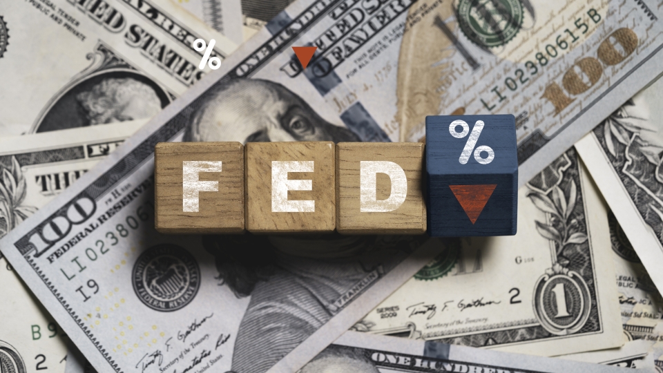 Stack of US Dollars with letters FED on top and percentage sign