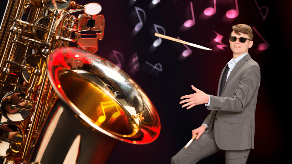 A giant saxophone and student with a drumstick