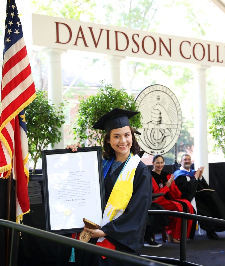 Arianna Montero Colbert with award plaque