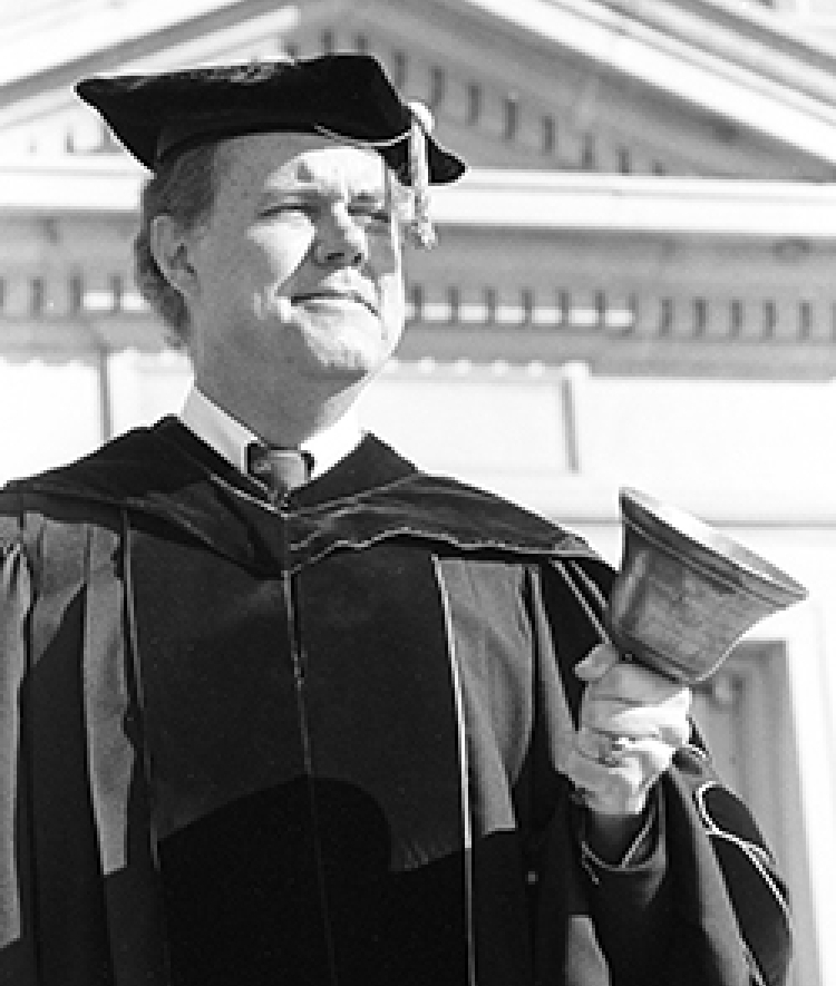 Leland Park rings hand bell at commencement